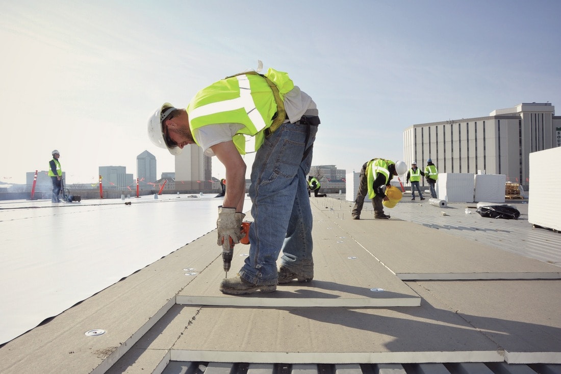 a roofing technician works on the commercial roof. What is the best commercial roof? 