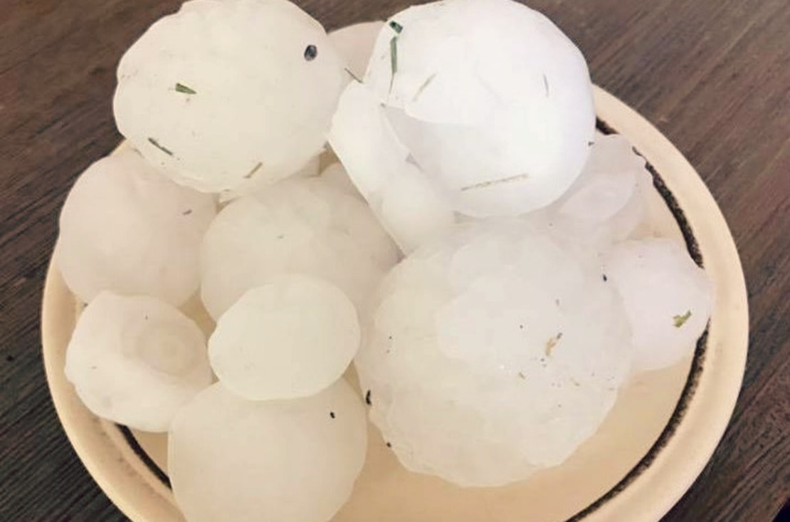 hail on the plate after the hailstorm in Dallas, TX that damaged many roofs